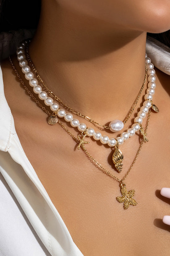 Layered Pearl and Gold Charm Necklace